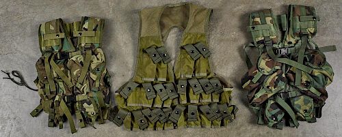 Vietnam era Alice aluminum frame rucksack, together with three later tactical vests.