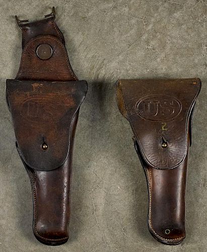 Two WW I era leather 1911 holsters, one stamped S & R JPC, the other unmarked.