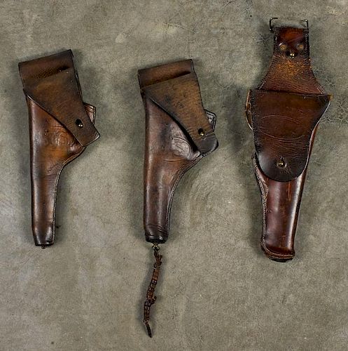 Three US Army leather holsters, including one inscribed Rock Island 1908, one G & K 1917, and