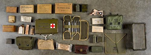 Group of WW I and WW II era first aid supplies, to include a snake bite kit, field dressing, foot