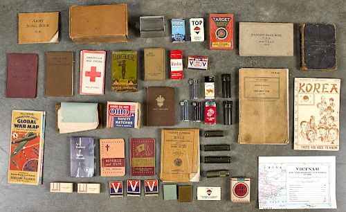 Group of military soldier related items, most WW II, to include cigarettes, lighters, matches, bib