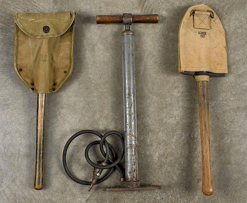 WW I shovel, inscribed 346 L US and Beaker 1917 on canvas cover, together with a WW II US mark