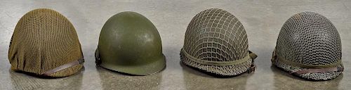 Four WW II era helmets, three with mesh covers, all with liners, together with a mesh net with bur