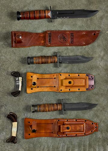 Three fighting knives, to include two Camillis pilot survival knives in sheathes with sharpening s