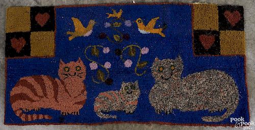 American hooked rug, 20th c., with cats, 24'' x 47 1/2''.