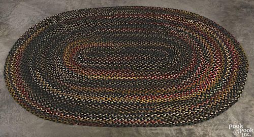 Oval braided rug, 8'10'' x 6'6''.