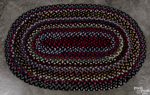 Oval braided rug, 5'7'' x 3'7''.