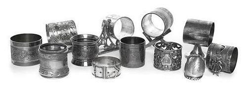 A Group of Twelve Silver and Silver-Plate Napkin Rings, Various Makers, Late 19th/Early 20th Century, comprising a French silver
