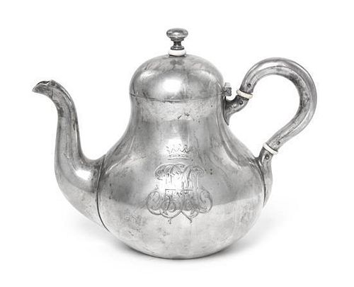 * A Russian Silver Teapot, Garvil Grachev, St. Petersburg, 1887, of baluster form with loop handle and scroll spout, engraved on
