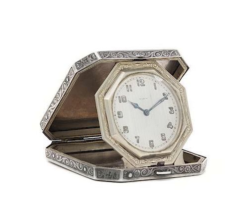 An American Silver Travel Clock, W.C.CC., Elgin, IL, Circa 1945, the hinged case square with cut-corners, engine-turned and with