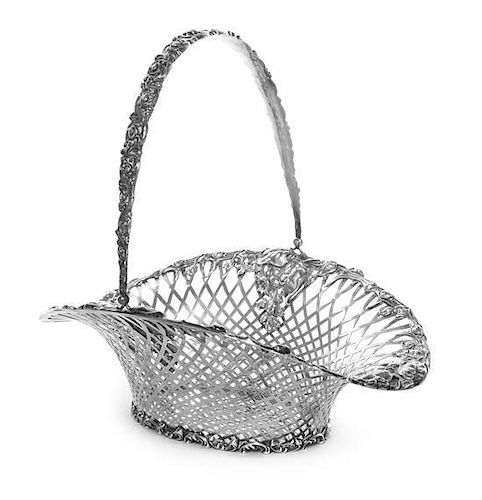 A Silver Basket, Probably American, 1st Half 20th Century, of oval form with pierced lattice sides and an applied rim with roseb