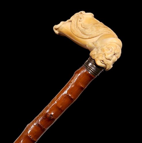 A 19TH C. CANE WITH UNUSUAL RUSTIC SHAFT & IVORY