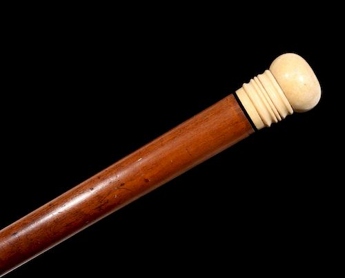 A 19TH C. CHERRY WOOD AND IVORY WALKING STICK