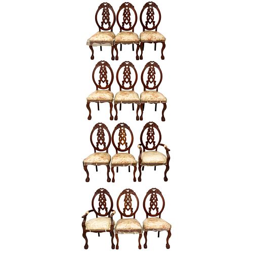 LOTE DE 12 SILLAS, SIGLO XX. Elaboradas en madera con acojinado y tapizado, cuentan con respaldo circular decorado.