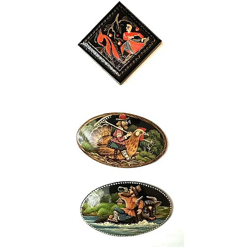 A small card of division three lacquerware buttons