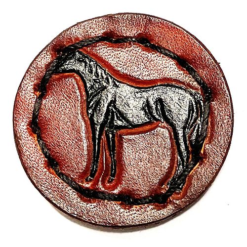 A division three embossed leather button