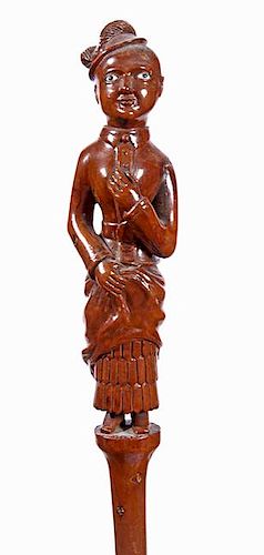 301. Full Figure Folk-Art Cane – Ca. 1880 – An English 9-inch carved lady with two-colored glass eyes, the figure is full