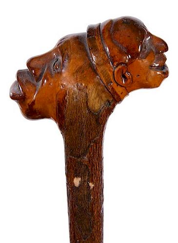 322. Master and Slave Folk-Art Cane – Ca. 1890 – An unusual “master and slave” carved cane with the master smiling on