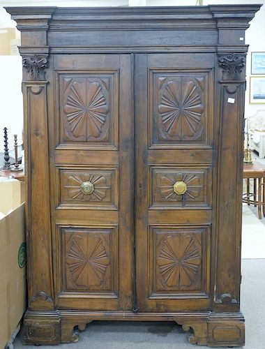 Large Italian armoire having two carved doors flanked by carved columns, 18th century. ht. 84in., wd. 59in., dp. 30in.