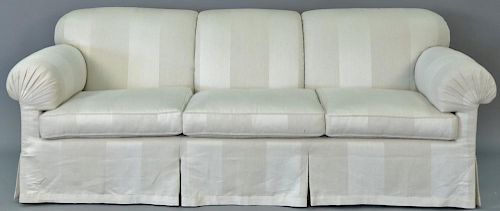 Off white upholstered custom sofa having rolled arms and back, very clean. lg. 88in.