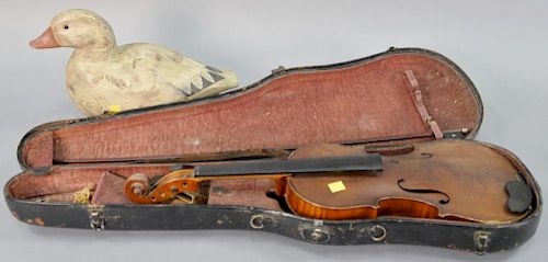 Two piece lot to include a violin with bow and original case along with a duck decoy signed D Howell #923 (lg. 14in.).