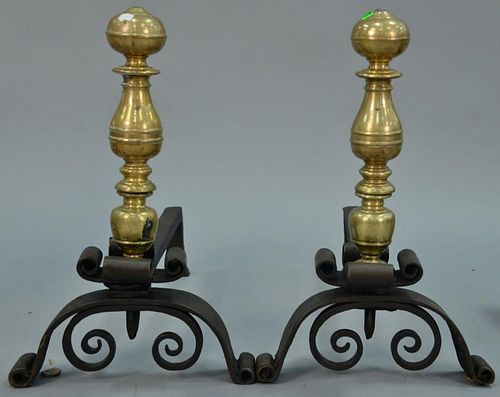 Italian Rococo pair of large heavy brass andirons on iron bases, antique brass on modern bases. ht. 21in.