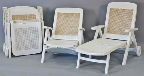 Set of four outdoor folding chairs/chaises.