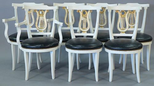 Set of eight dining chairs, painted white with gilt harp backs, two armchairs and six side chairs.