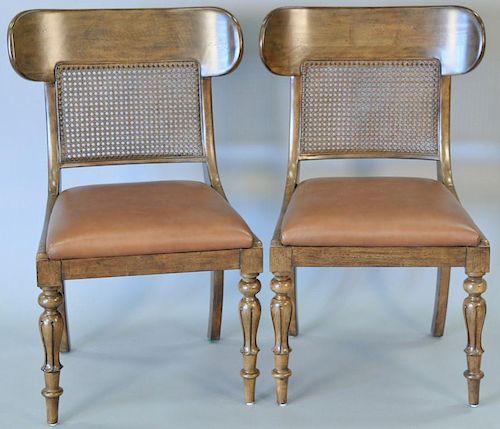 Set of eight Ralph Lauren Regency style chairs having caned backs and leather seats.