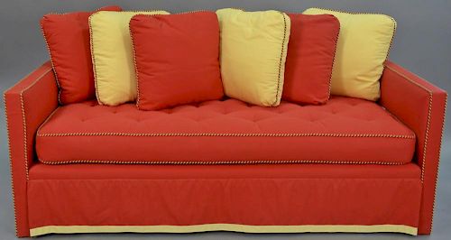 Charles Beckley custom upholstered day or trundle bed with red and yellow blended cotton felt upholstery and throw pillows. l