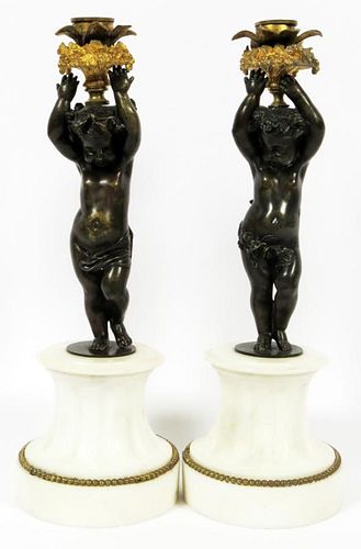 BRONZE AND WHITE MARBLE FIGURAL CANDLESTICKS PAIR