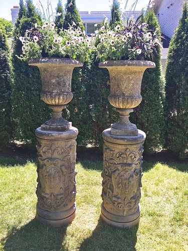 Pair of Tall English Cast Stone Urns on Carved Stone Pedestals