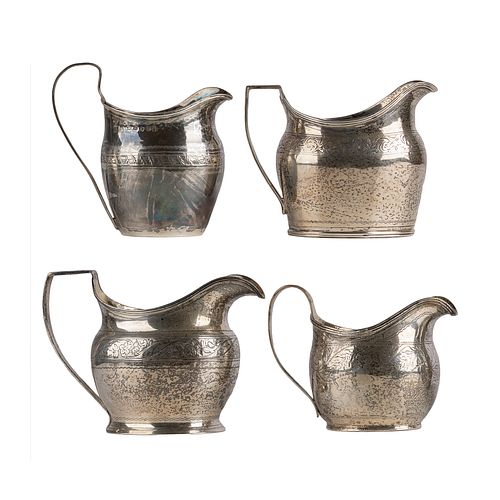 A collection of Georgian Sterling Cream Pitchers