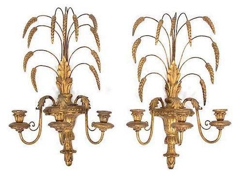 A Pair of Louis XV Style Carved Giltwood and Gilt Metal Three-Light Wall Sconces Height 21 x width 13 inches.