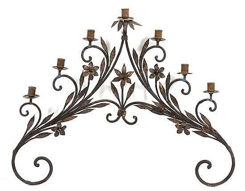 A Continental Wrought Iron Seven-Light Wall Sconce Height 26 x width 30 1/2 inches.