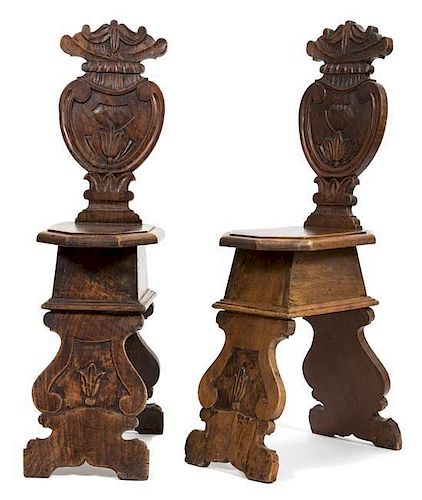 A Pair of Italian Carved Oak Sgabello Hall Chairs Height 42 inches.
