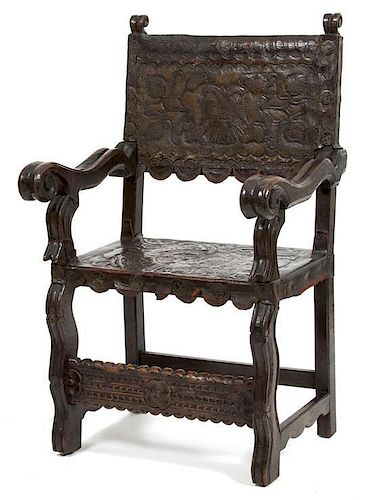 An Italian Baroque Carved Walnut & Leather Armchair Height 40 1/2 x width 24 x depth 20 inches.