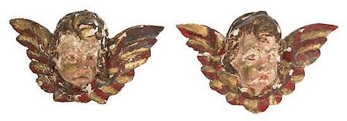A Pair of Italian Painted and Parcel Gilt Putto Masks Height 6 x width 10 x depth 5 inches.