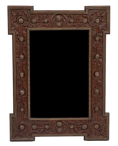 An Italian Brass Mounted Carved Oak Mirror Height 32 x width 24 inches.