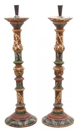A Pair of Italian Faux Painted Pine Candlesticks Height 29 inches.