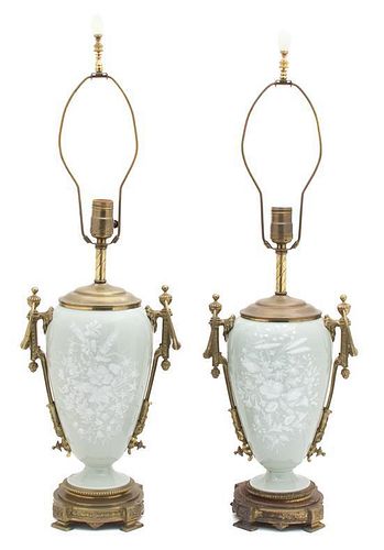 A Pair of French Ormolu Mounted Pate-sur-pate Celadon Glazed Porcelain Lamps Height overall 29 inches.