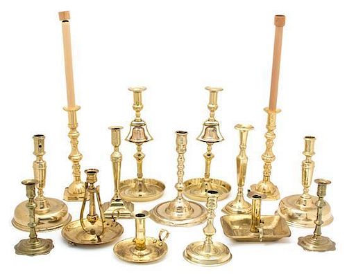 A Group of American Brassware Candlesticks Height of largest 20 inches.