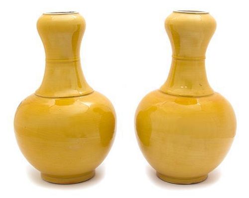 A Pair of Chinese Yellow Glazed Porcelain Vases Height 13 1/2 x diameter 7 1/2 inches.