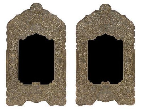 A Pair of Syrian Stamped Metal Mirrors Height 34 x width 19 1/2 inches.
