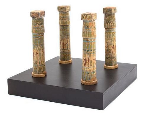 A Group of Four Miniatured Egyptian Painted Columns Height of each column 5 3/8 inches.