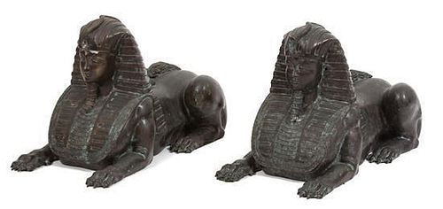 A Pair of Continental Bronze Sphinxes Length 22 inches.
