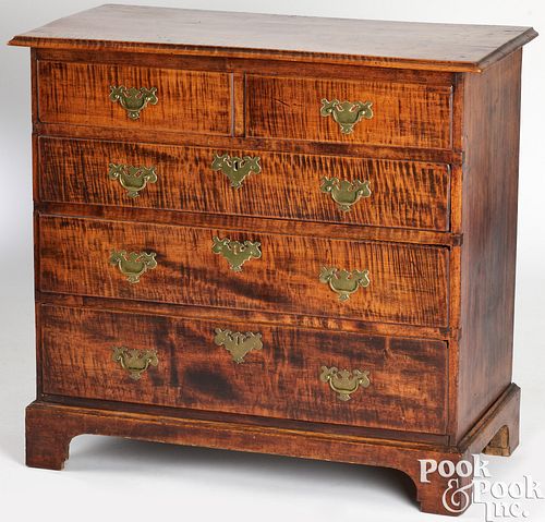 Diminutive tiger maple chest of drawers