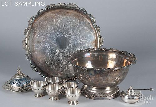 Large group of silver plated serving pieces.