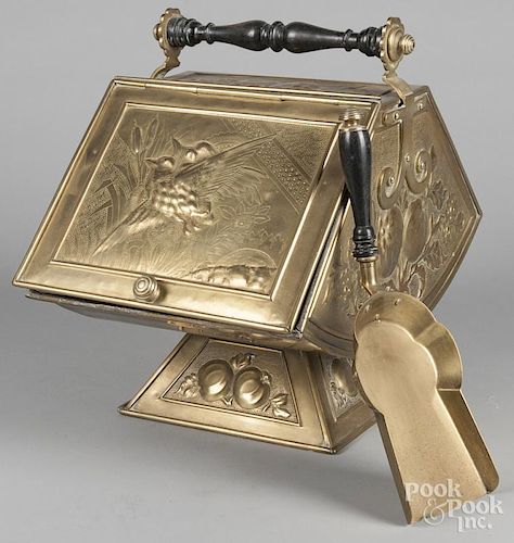 Embossed brass coal scuttle, with shovel, 16'' h., 19'' w.