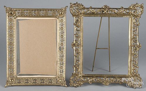 Two brass picture frames, 20'' x 17 1/4''and 19 1/2'' x 15''.